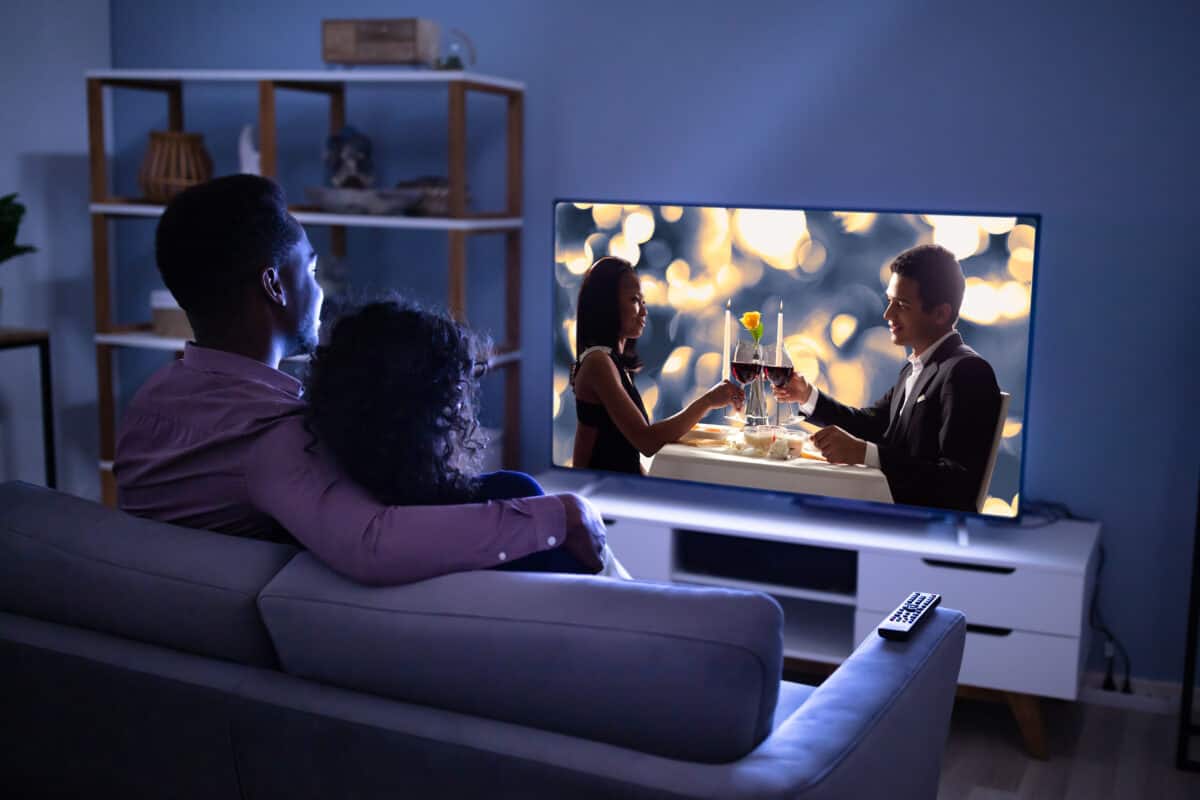 couple watching tv in living room