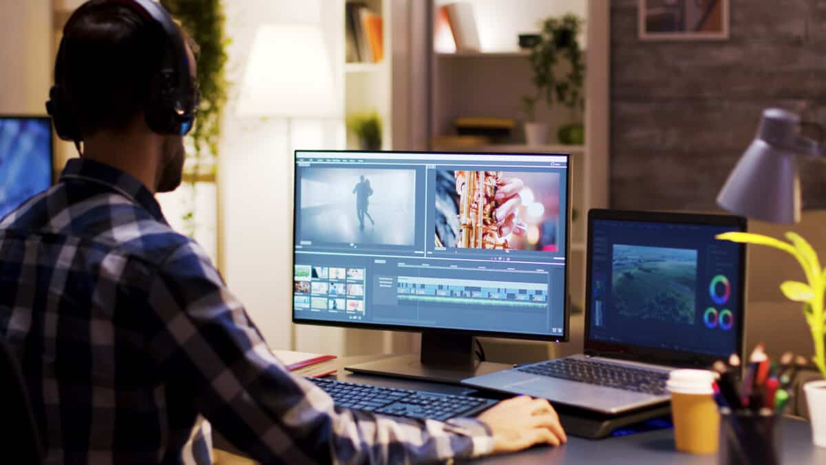 Film maker pointing at the monitor