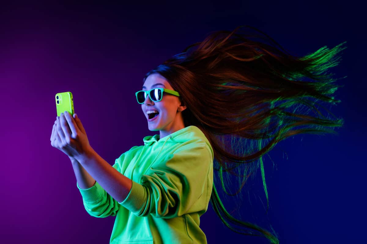 woman looking at mobile phone internet connection wi-fi