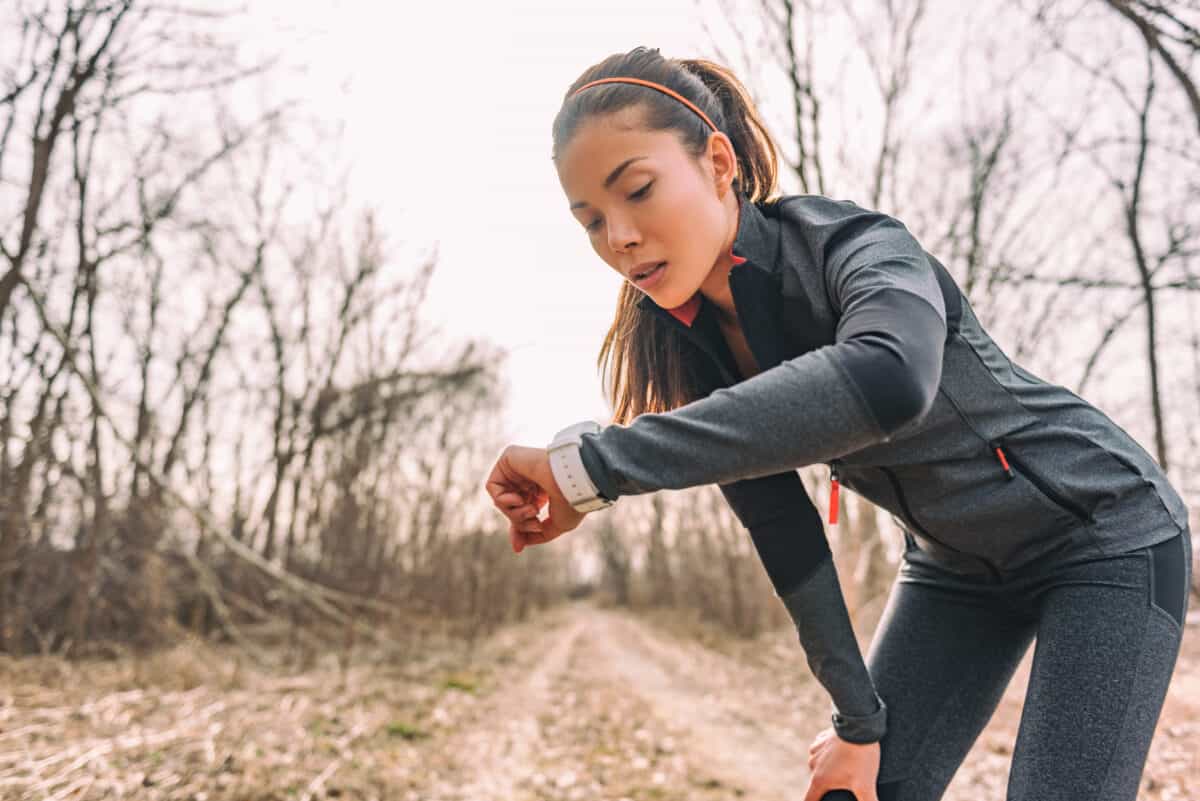 woman looking at exercise gps watch smartwatch