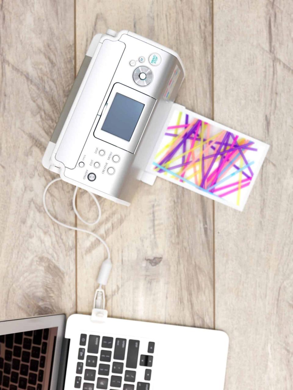 A close up shot of a portable photo printer