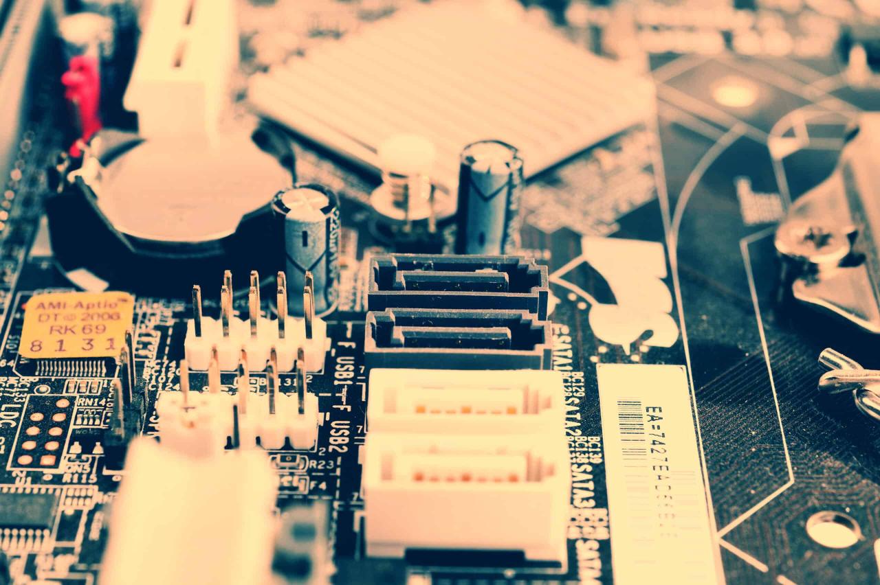Micro atx motherboard with SATA connectors inside a PC.