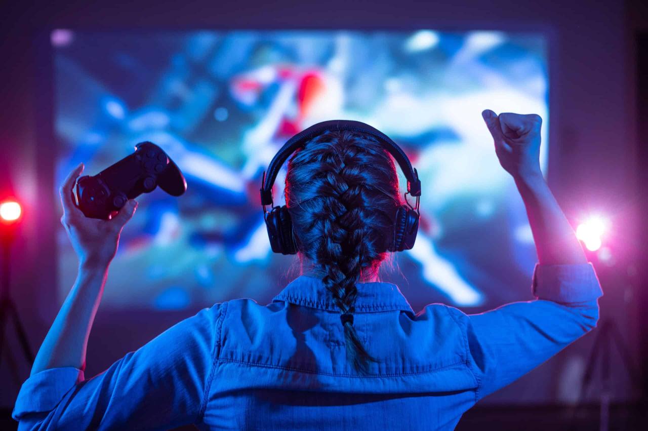 woman playing video games gaming gamer headphones headset